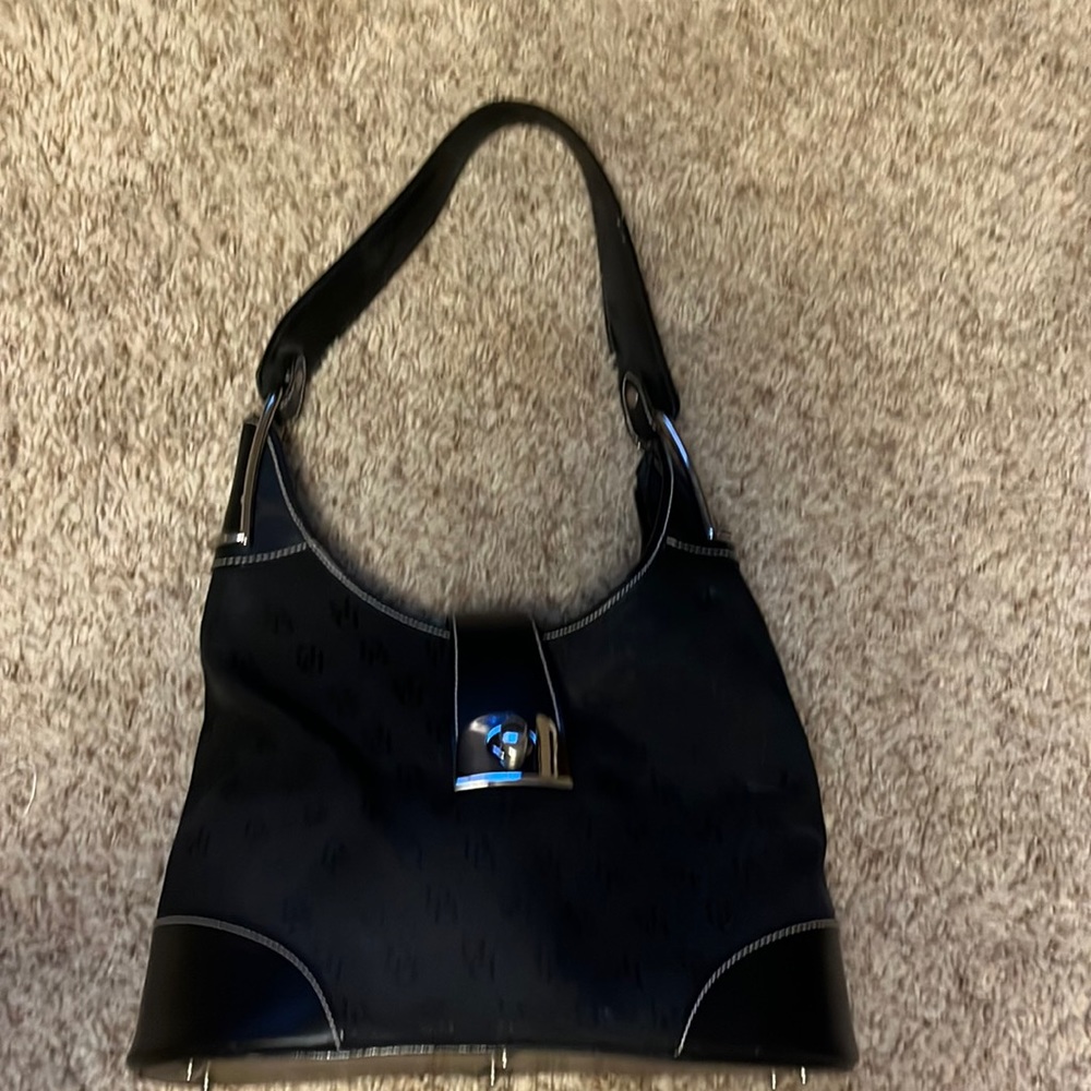 Dooney and Bourke black purse with silver hardware.